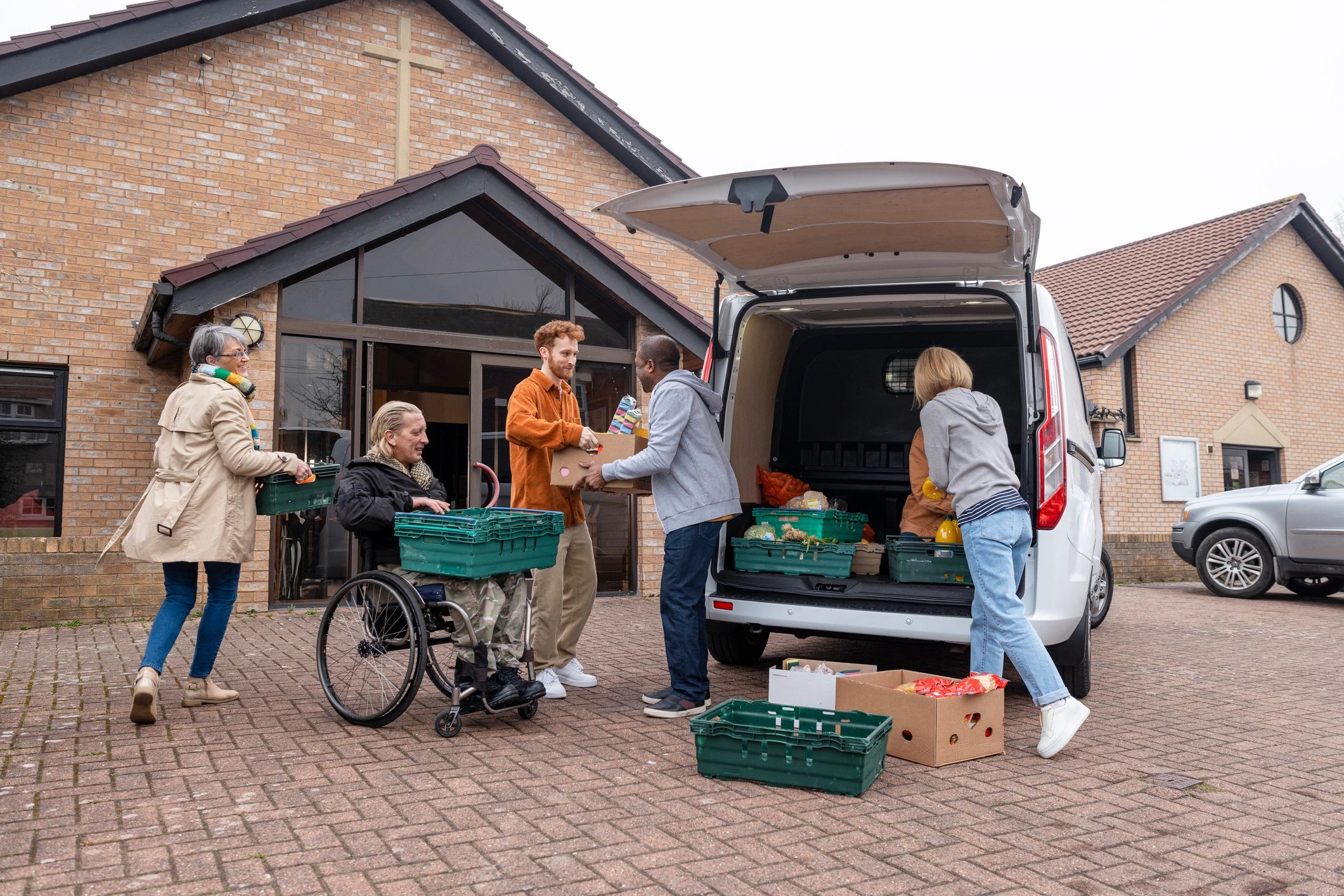 Volunteers unloading food donations together